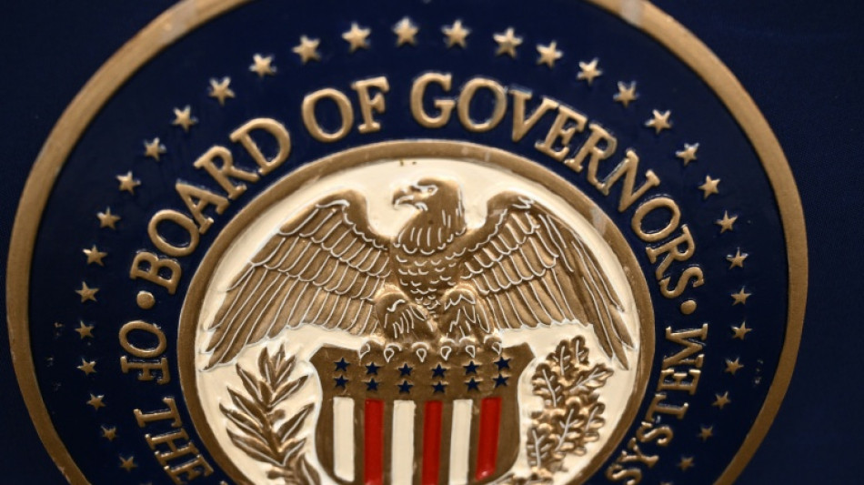 Gold hits record, stocks slip as Trump fuels Fed fears