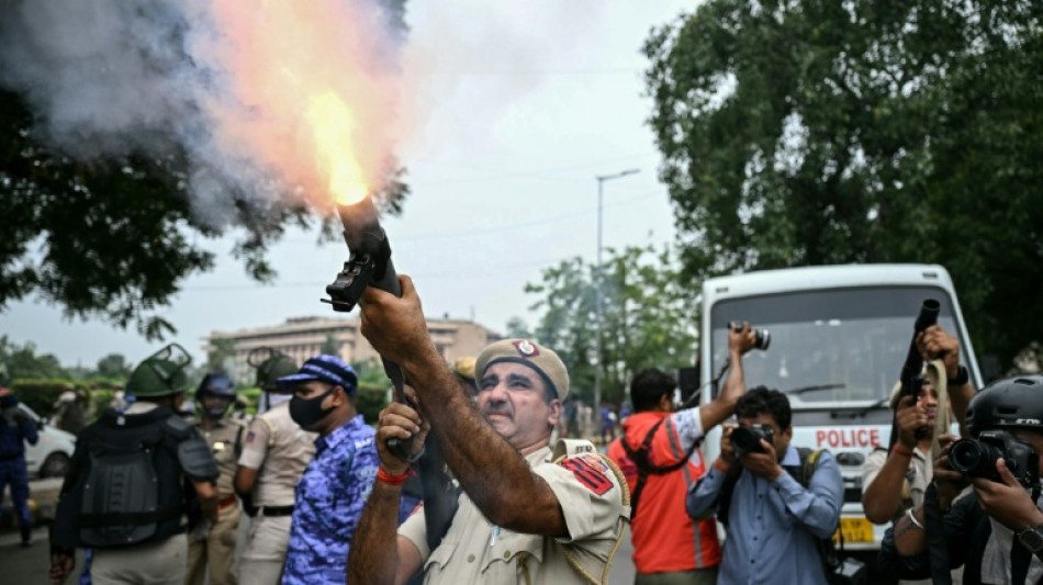 Indian police fire tear gas, baton charge exam protesters 