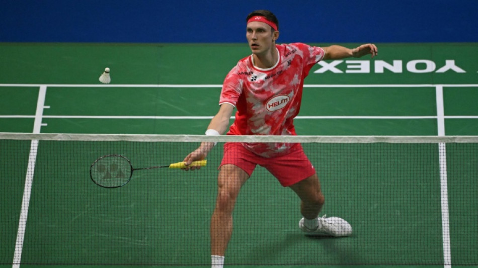 Emotional Axelsen well beaten on return from six months out