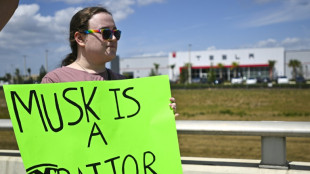 Protesters denounce Musk at Tesla dealerships in US, Europe