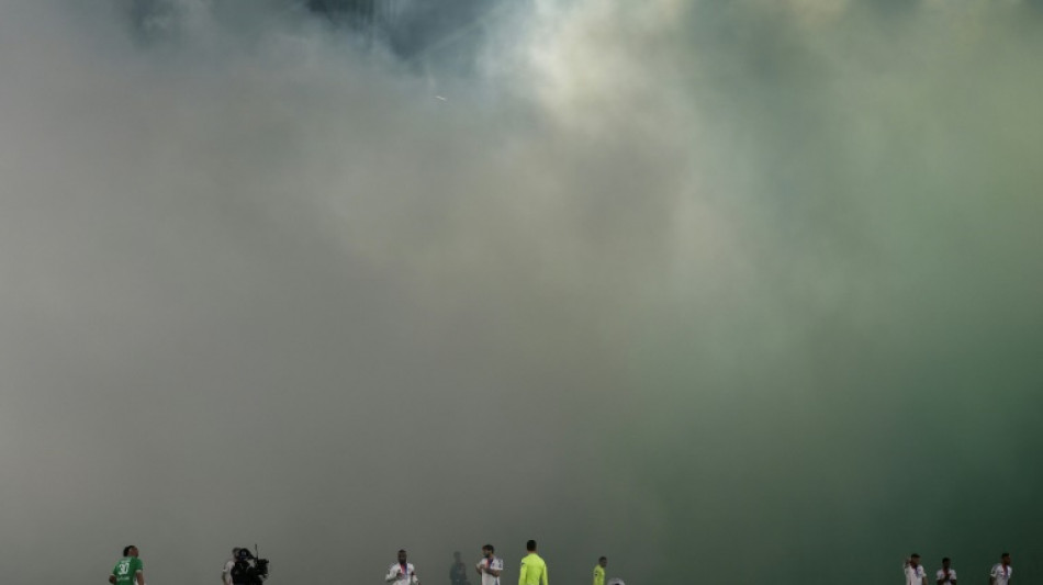 Ligue 1 derby halted after assistant referee hit by projectile 