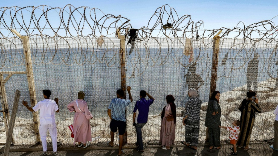 Moroccans gather at Ceuta border, desperate for news of loved ones