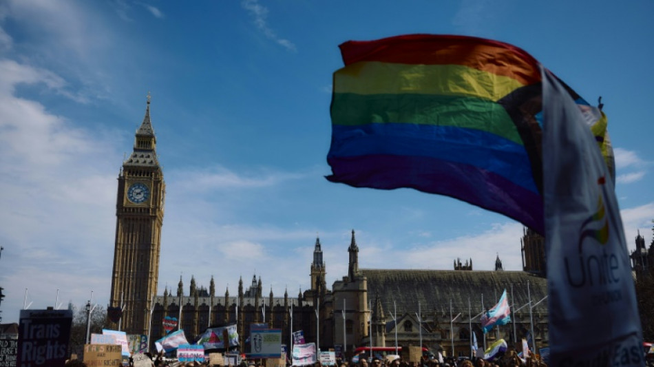 Trans rights supporters rally outside UK parliament after landmark ruling