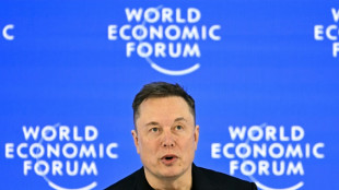 Musk makes Davos debut with promise of robots for all