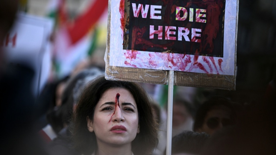 Thousands march in France to back Iranian protesters